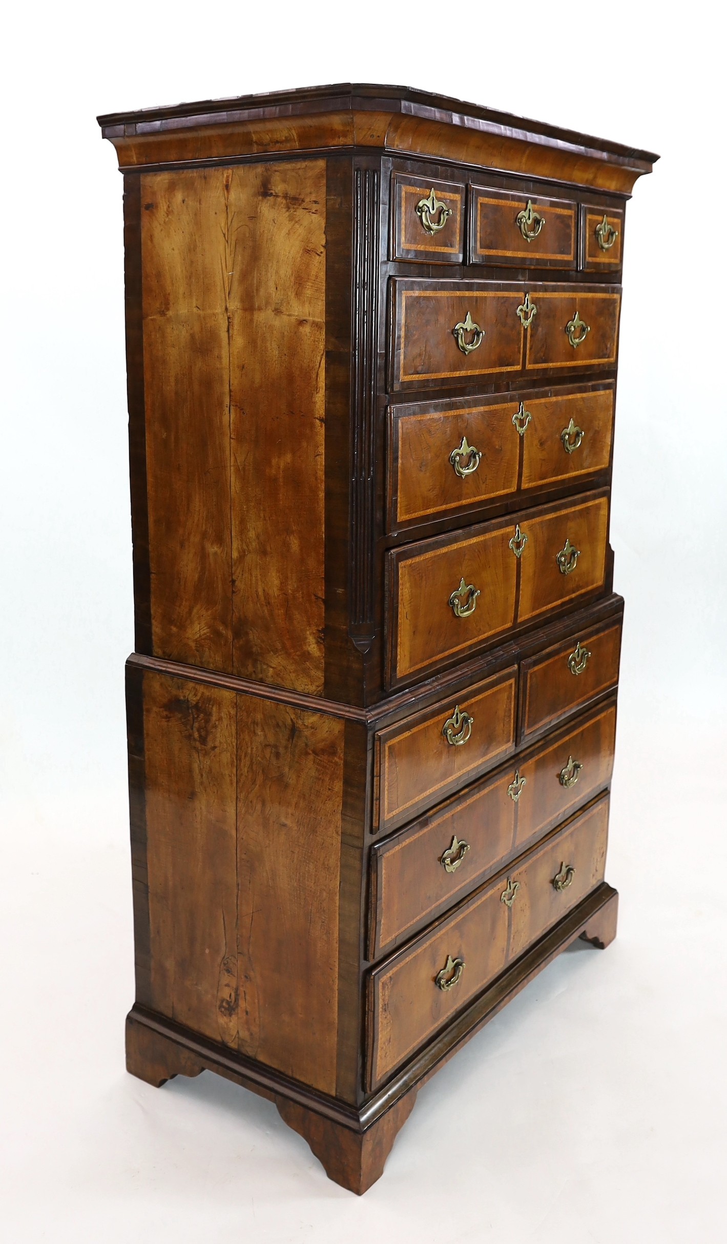 A George II featherbanded walnut chest on chest, width 100cm, depth 51cm, height 165cm